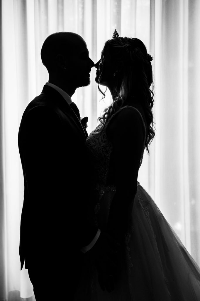 silhouette of a very elegant married couple couple's photo shoot during their wedding